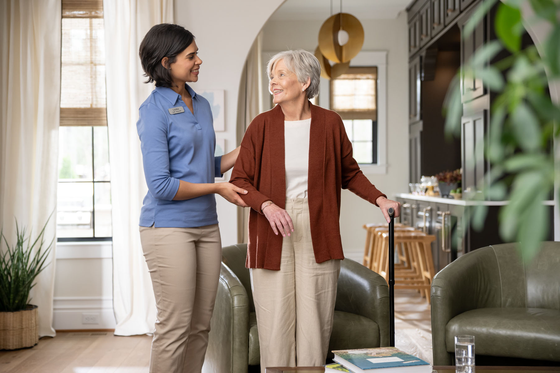 A home care professional assisting an older adult